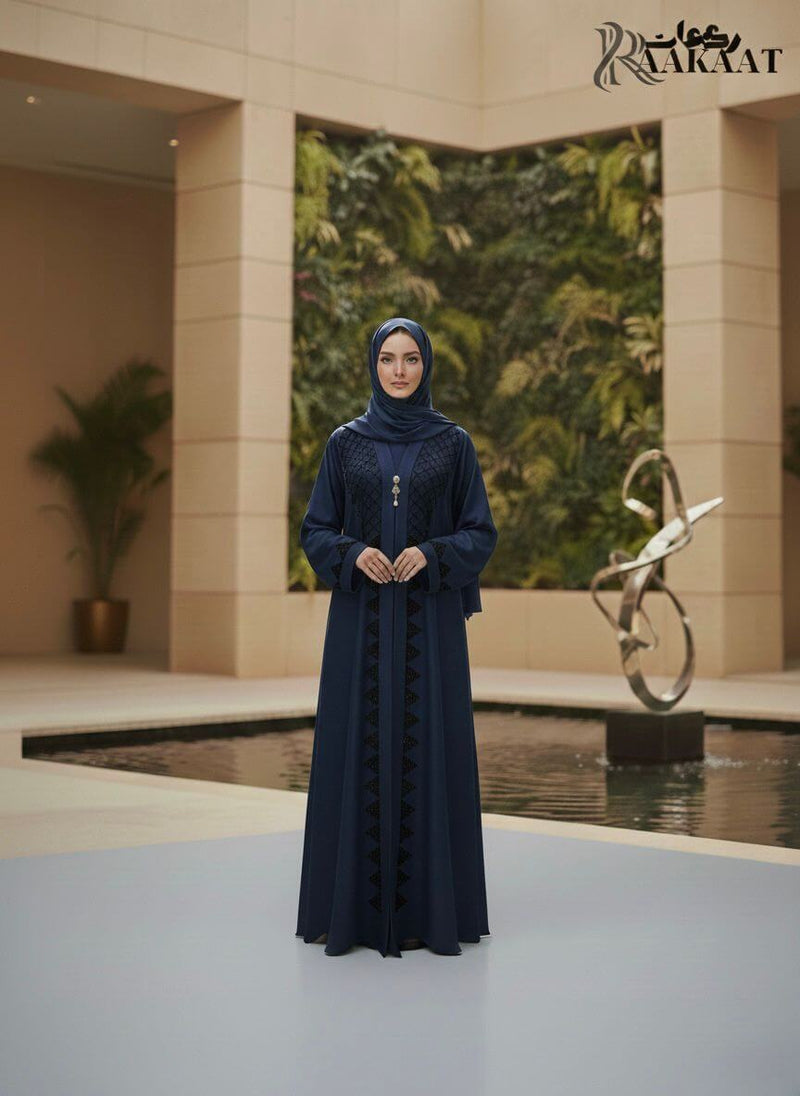 Hand-Crafted Textured Embroidery Abaya Set A0004 worn by a model, showcasing intricate embroidery and a tailored silhouette.