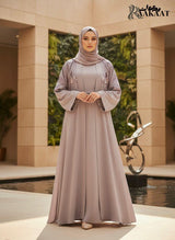The Signature Floral Meadow Open-Front Abaya A0005 worn by a model in a serene environment, showcasing intricate embroidery.