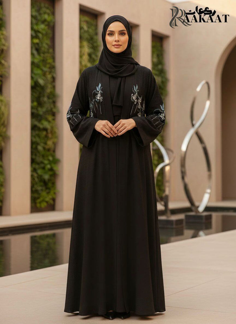 Elegant Black Floral Embroidered Open Abaya with Soft Draped Fit A0008 worn by a model, showcasing delicate embroidery and flowy silhouette.
