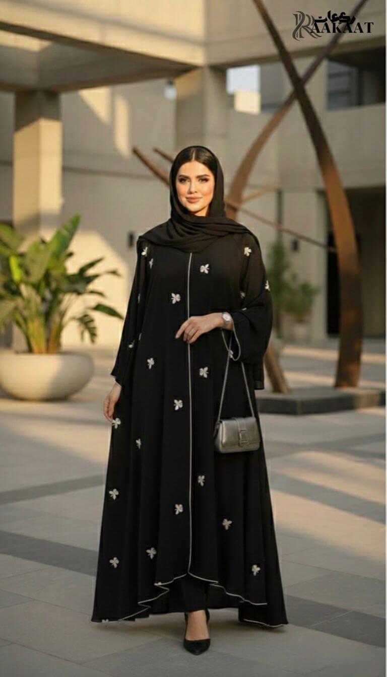Classic Black Butterfly Embroidered Open Abaya with Contrast Piping  A0007 worn by a woman in outdoor setting.