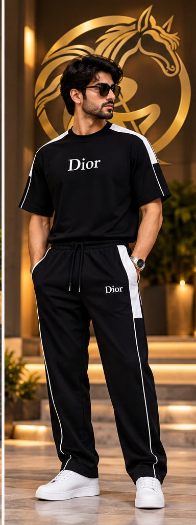 Men's black matching T-shirt and jogger pants set lifestyle model photo with gold Raakaat icon in background