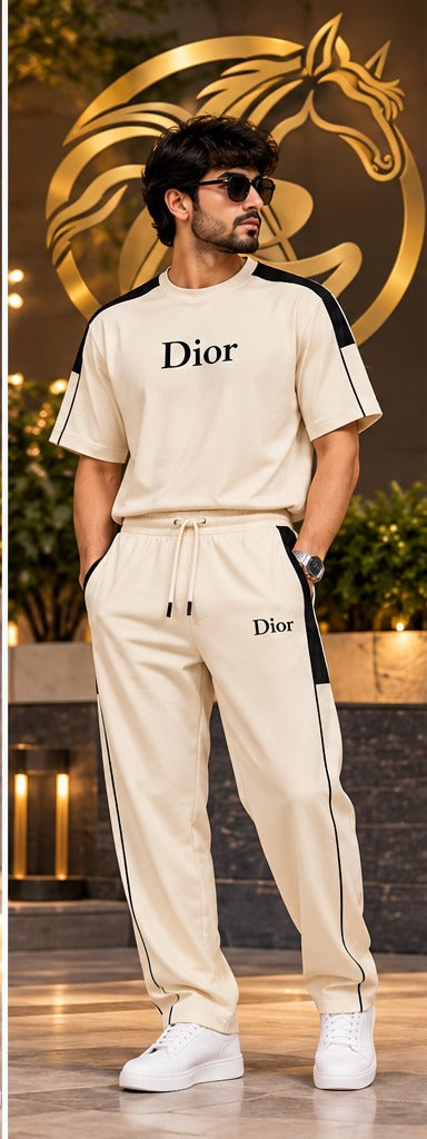 Men's cream matching T-shirt and jogger pants set lifestyle model photo with gold Raakaat icon in background