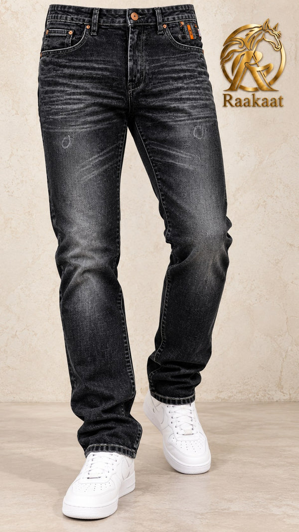 Men's black faded wash jeans – waist-to-shoes angle view
